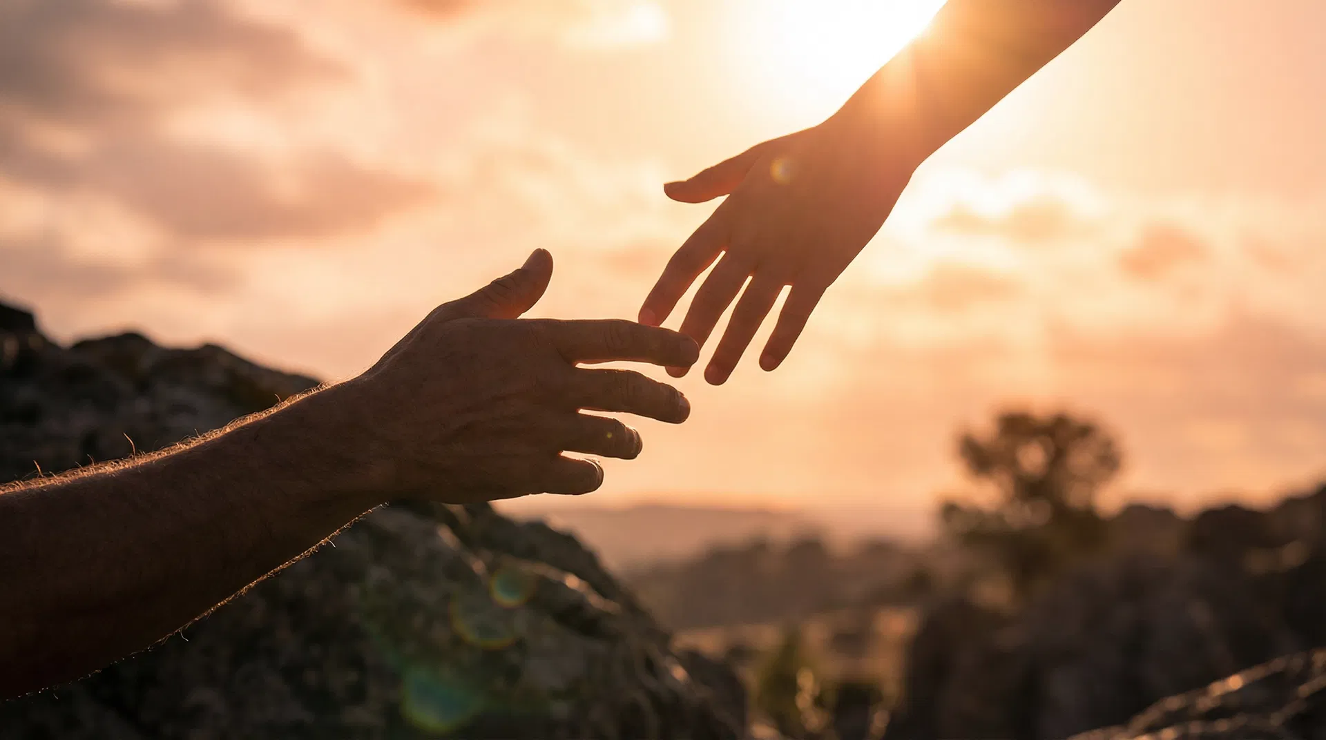 Hands reaching to help