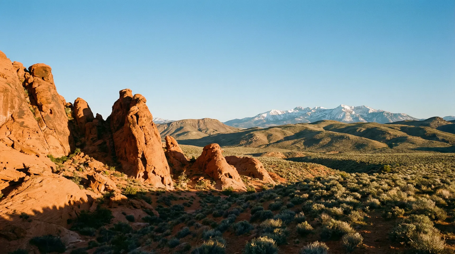 Nevada desert landscape with red rock formations and mountains