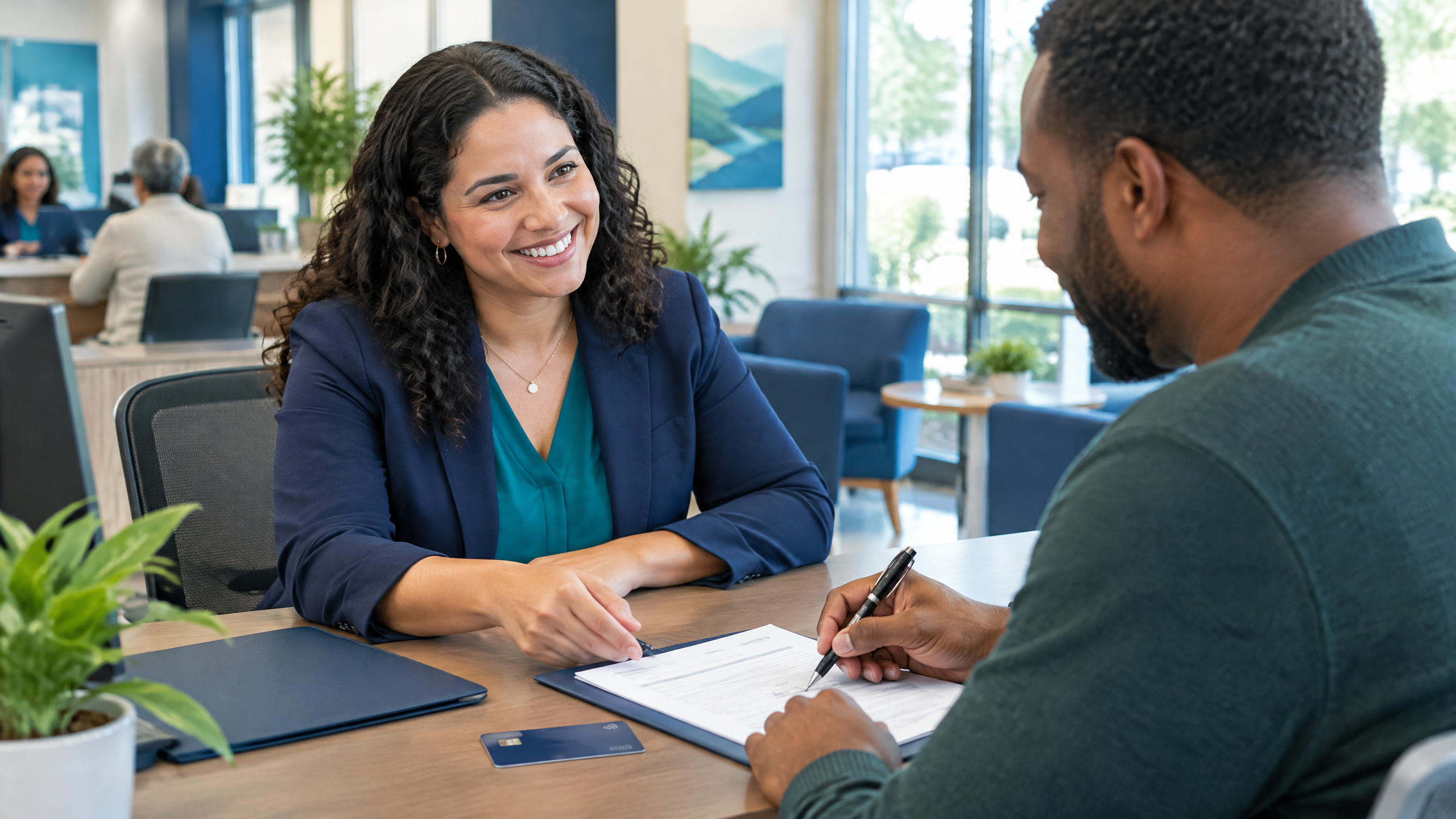 A customer opening a checking account with a banker at a community branch
