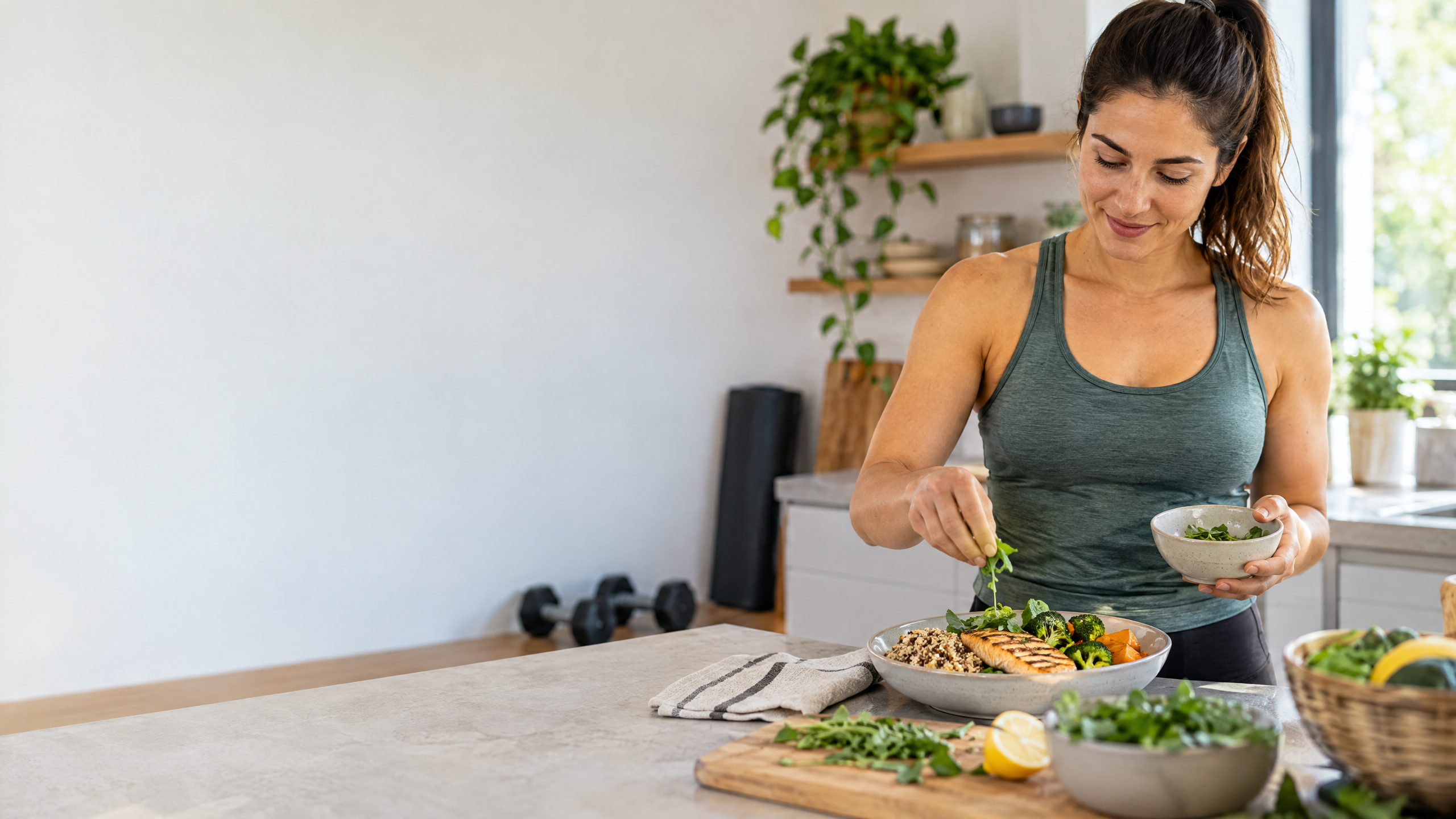 An adult preparing a balanced protein-rich meal after a resistance-training workout.