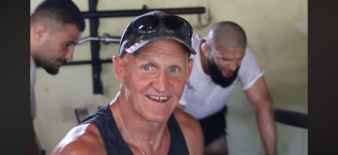 Khamzat training with Coach Cal in garage