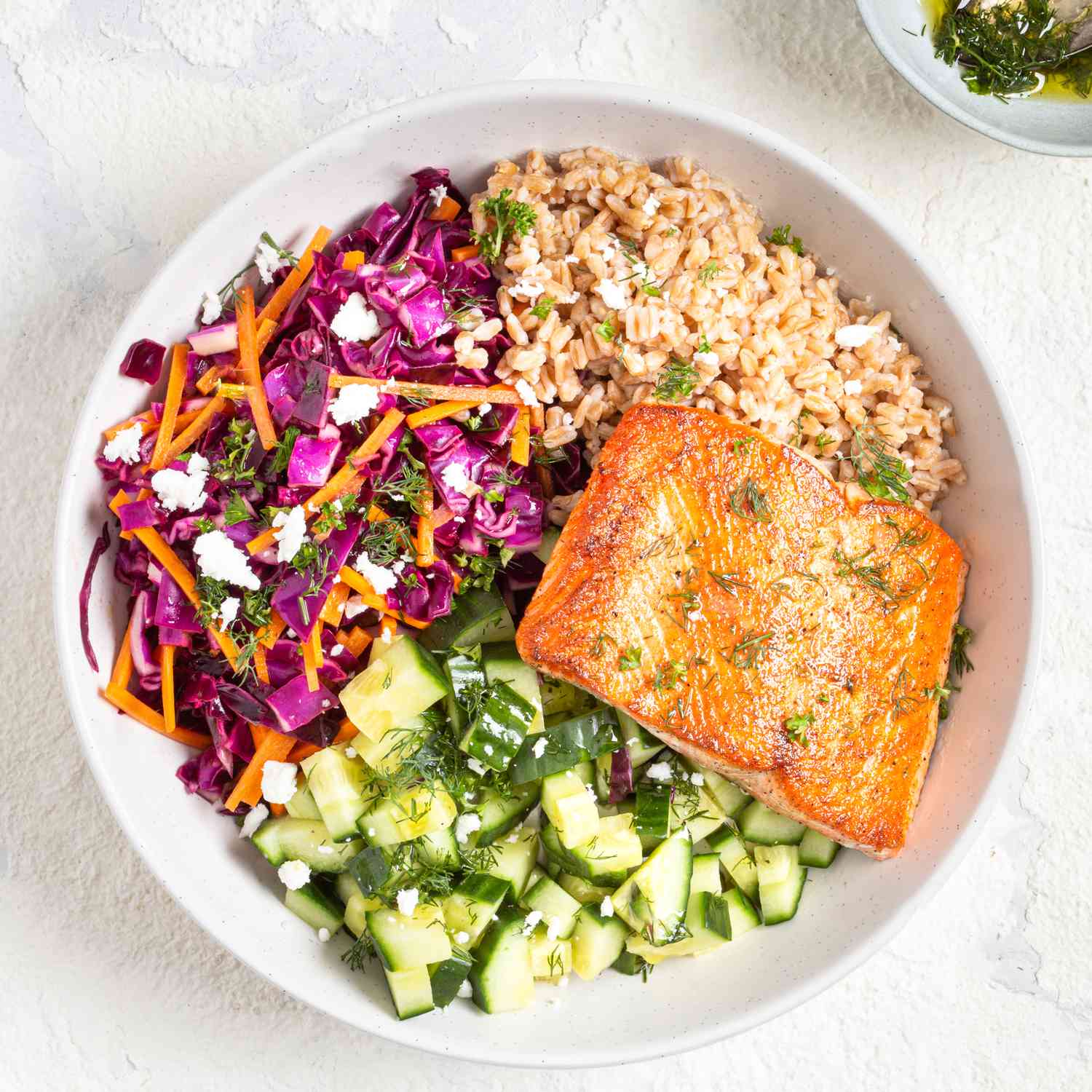 A colourful, healthy and protein-rich salmon and vegetable bowl, representing the ideal meal while on GLP-1 medication.