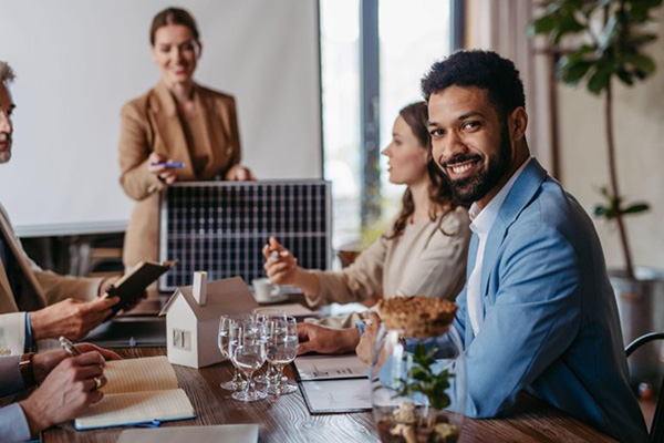 Energy brokers in a meeting discussing a contract