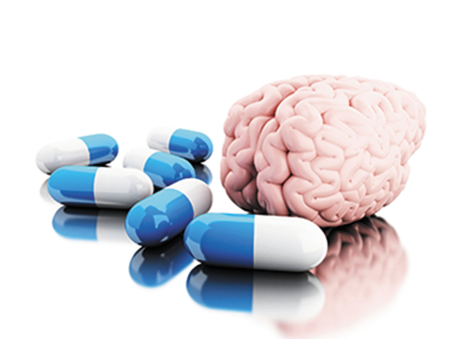 A brain model surrounded by various pills and capsules, symbolizing cognitive enhancement through supplements.