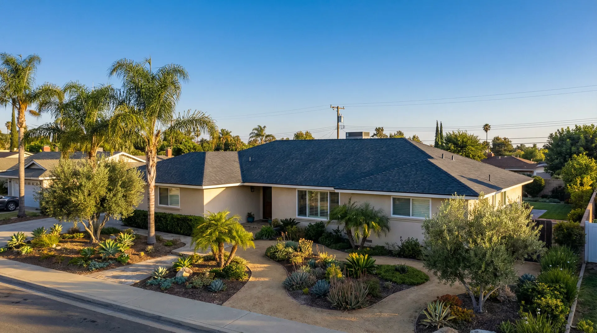 Completed roof replacement on a California ranch-style home with pristine new dark slate roof