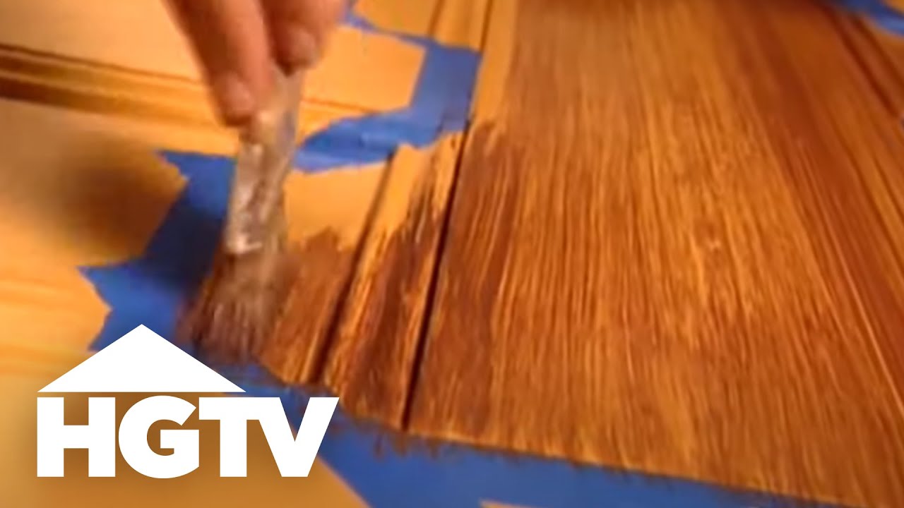 A demonstration of a faux wood grain paint technique.