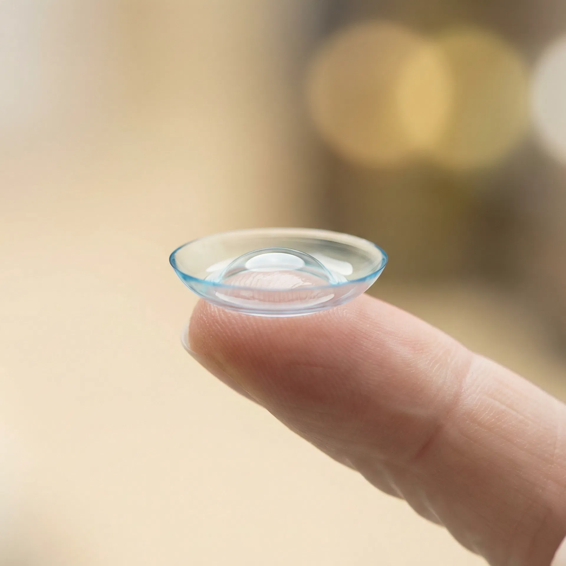 Custom scleral contact lens on fingertip