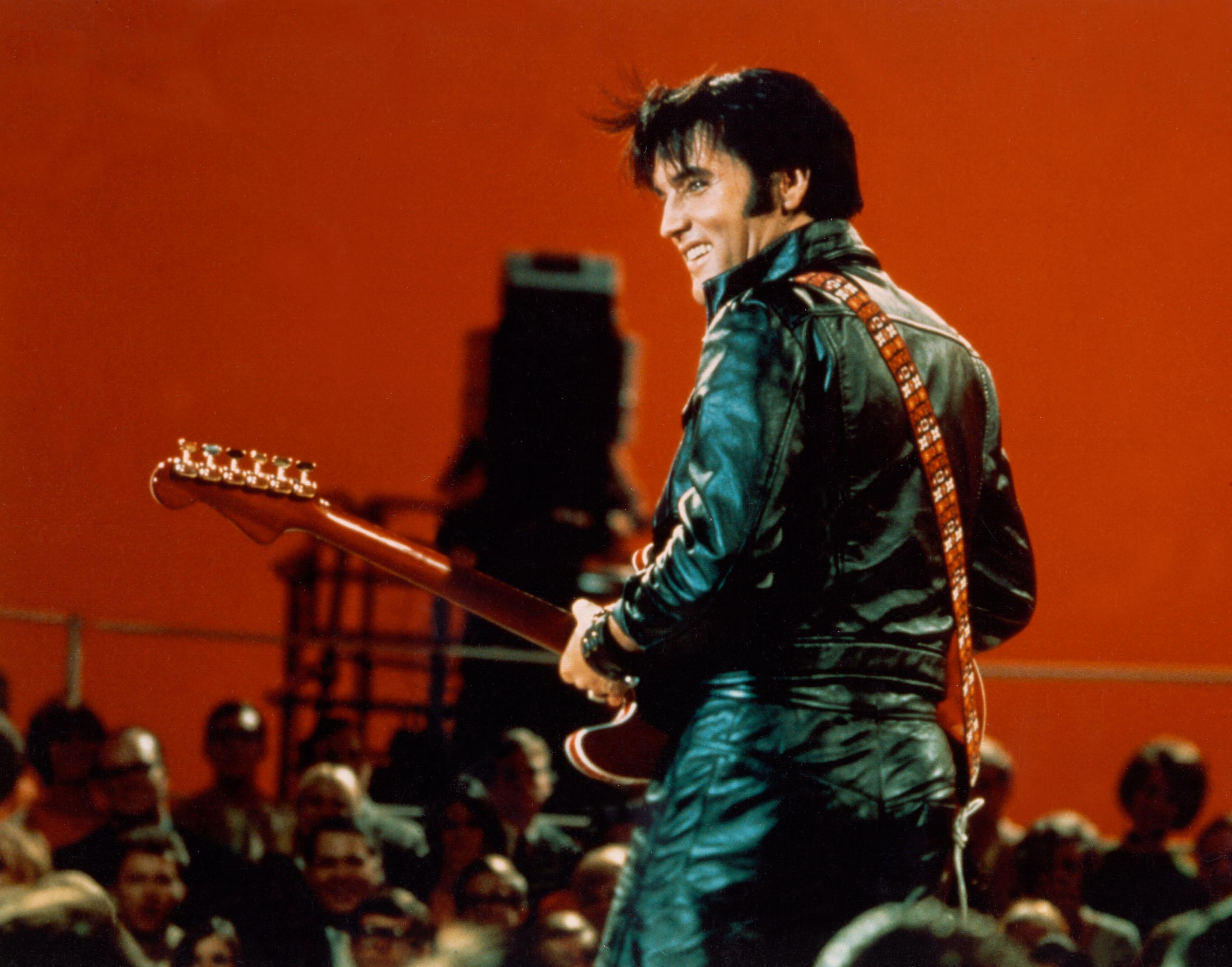 Elvis performing during the '68 Comeback Special in his iconic black leather suit