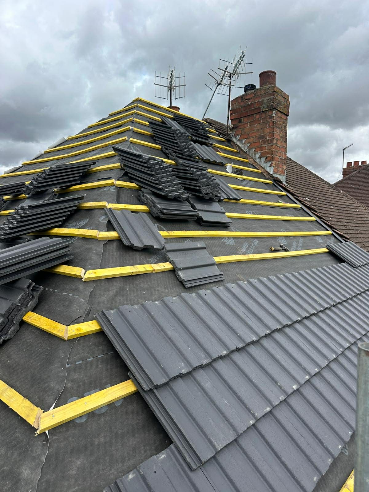 Completed slate roof installation by AGN Group