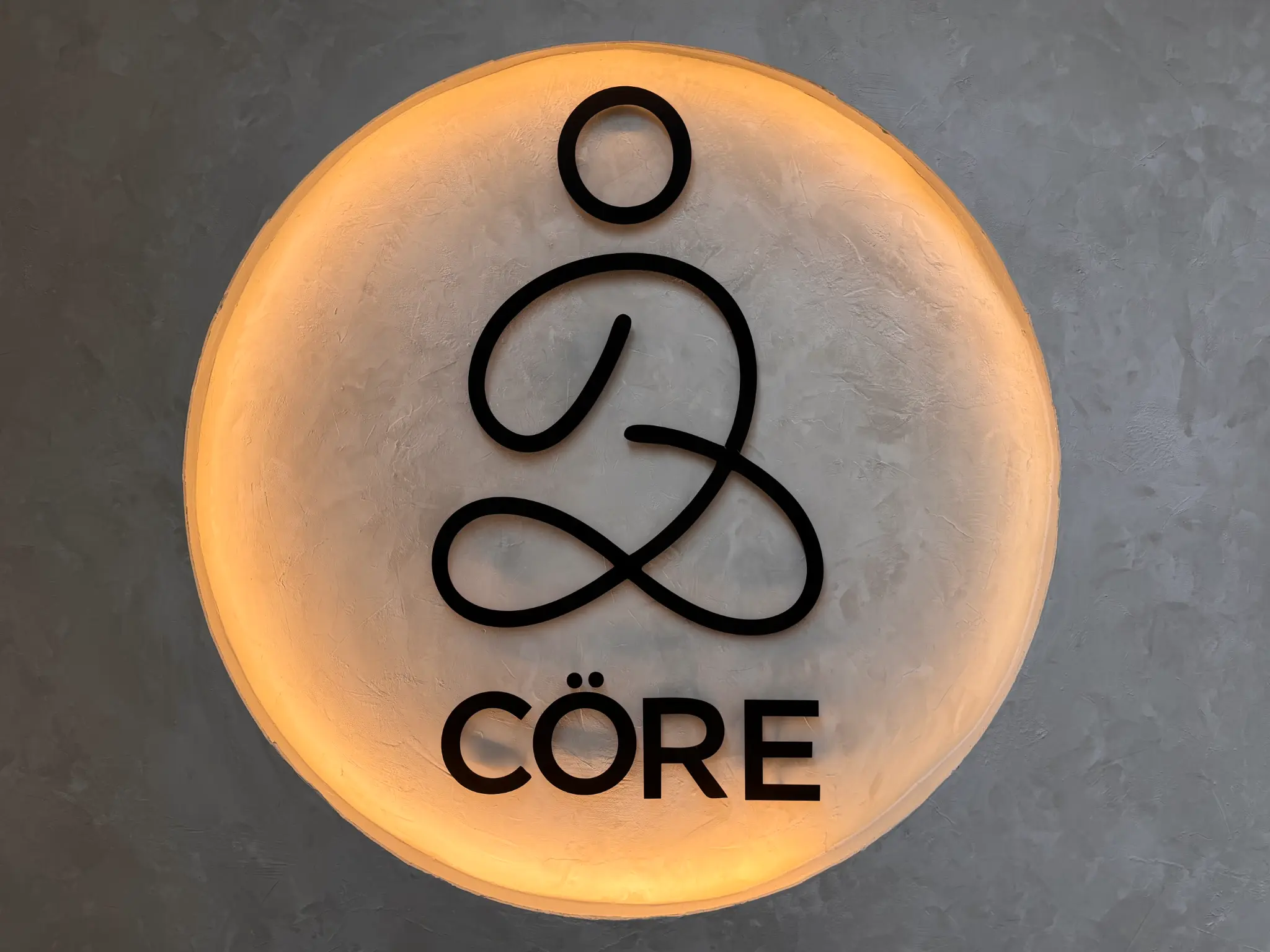 Cöre illuminated logo sign