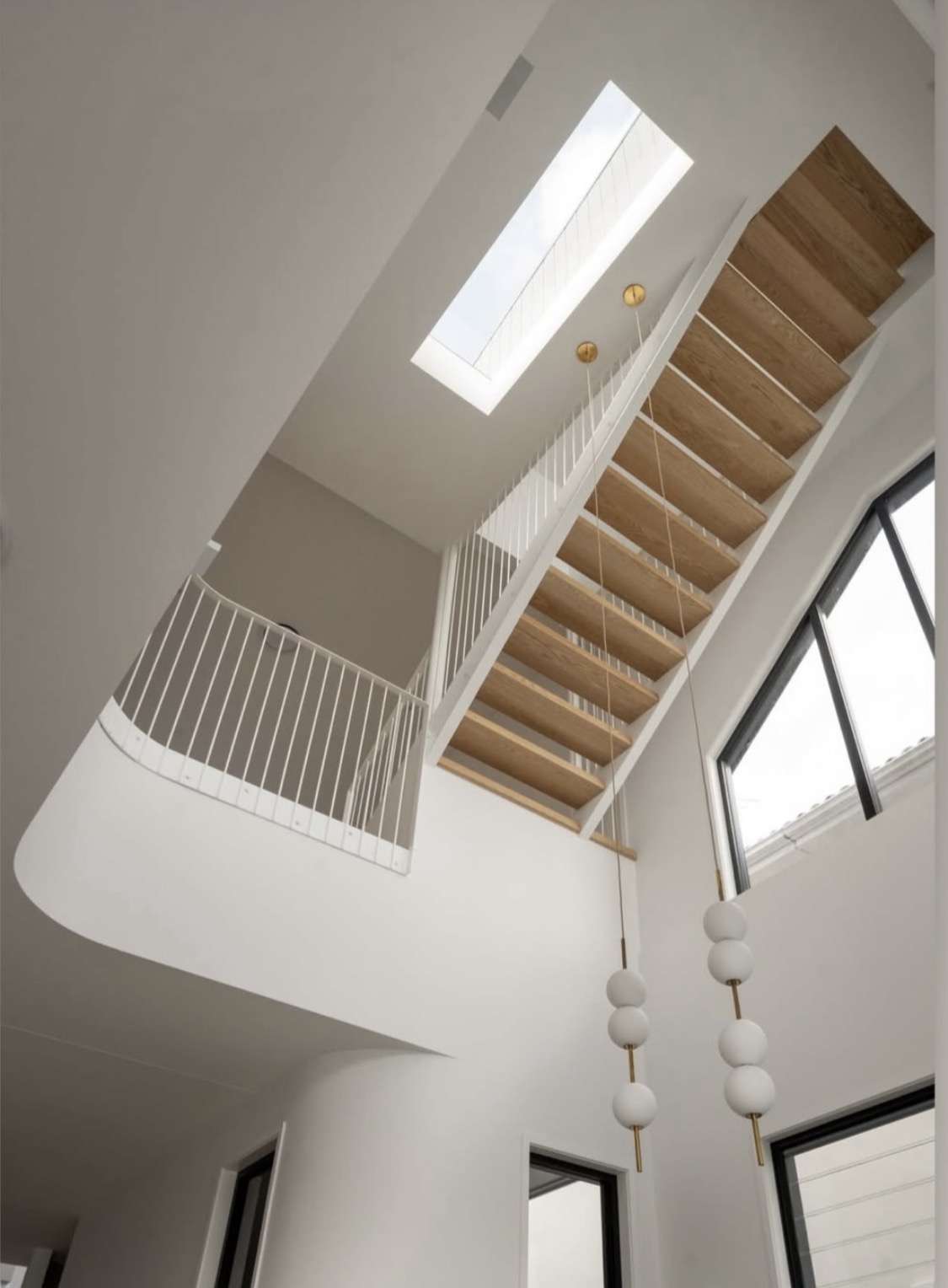 Floating Staircase & Double-Height Void