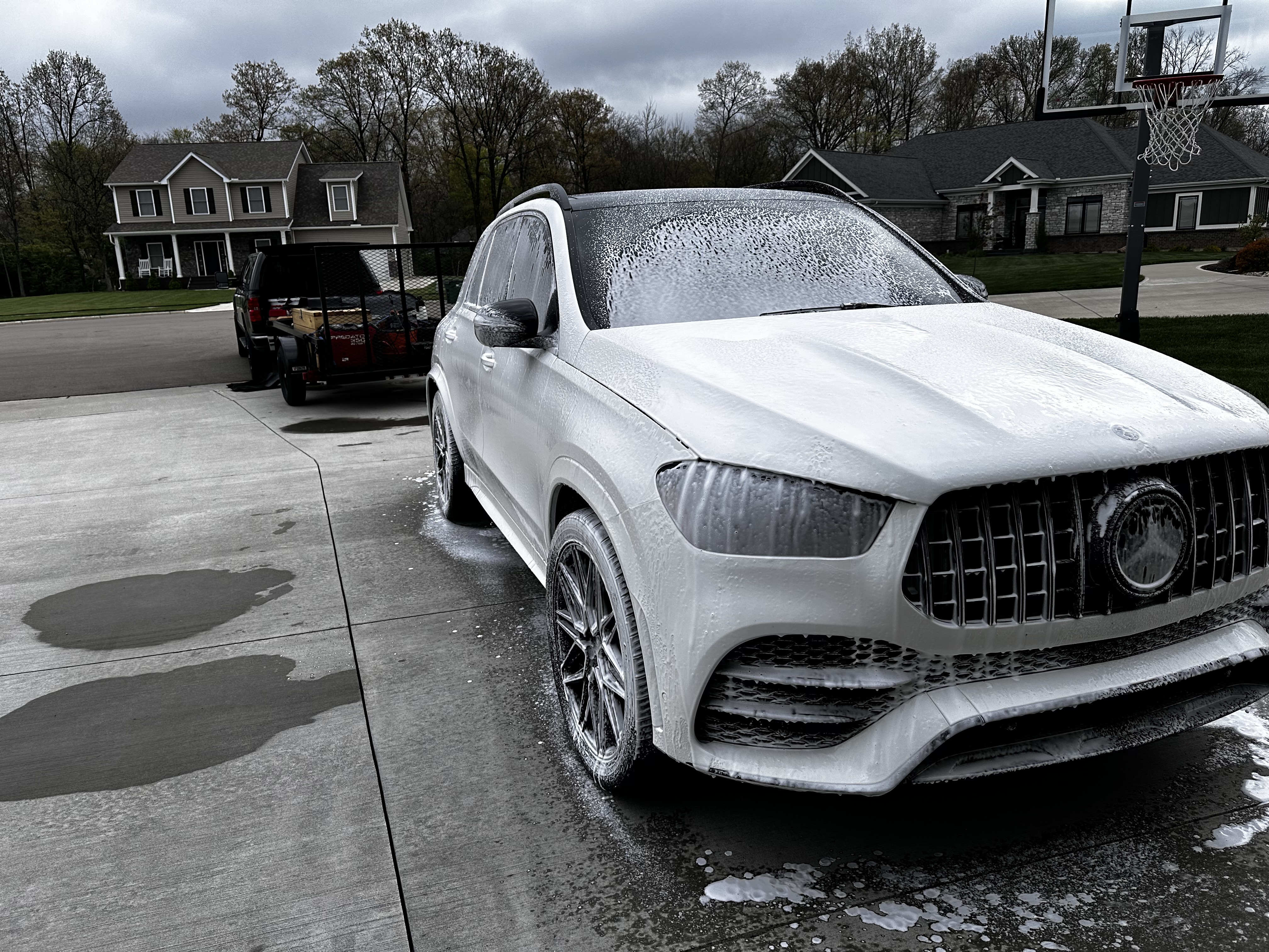 Professional mobile auto detailing — foam wash on a Mercedes GLE