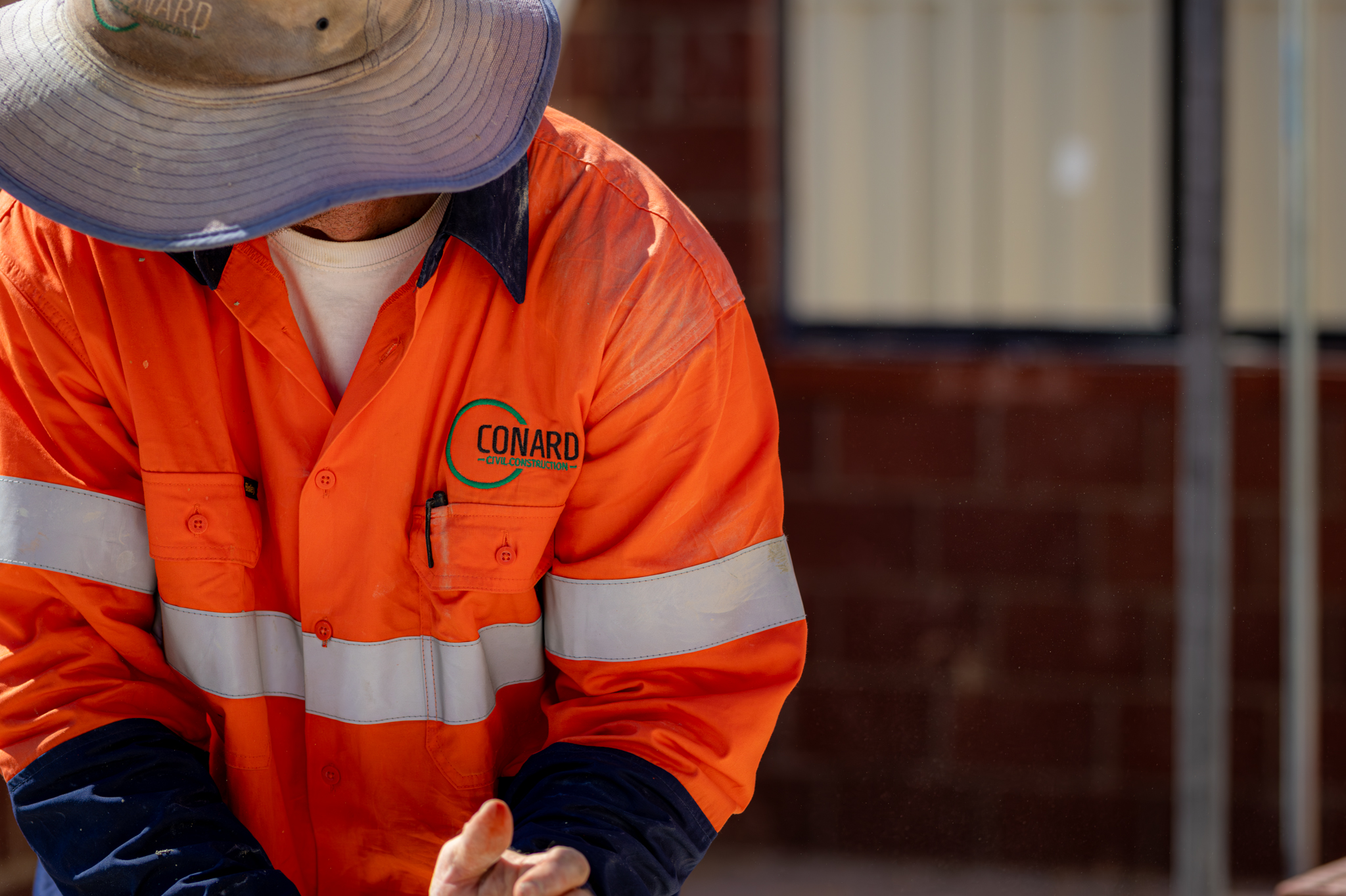 Conard Civil Construction — block laying with string line
