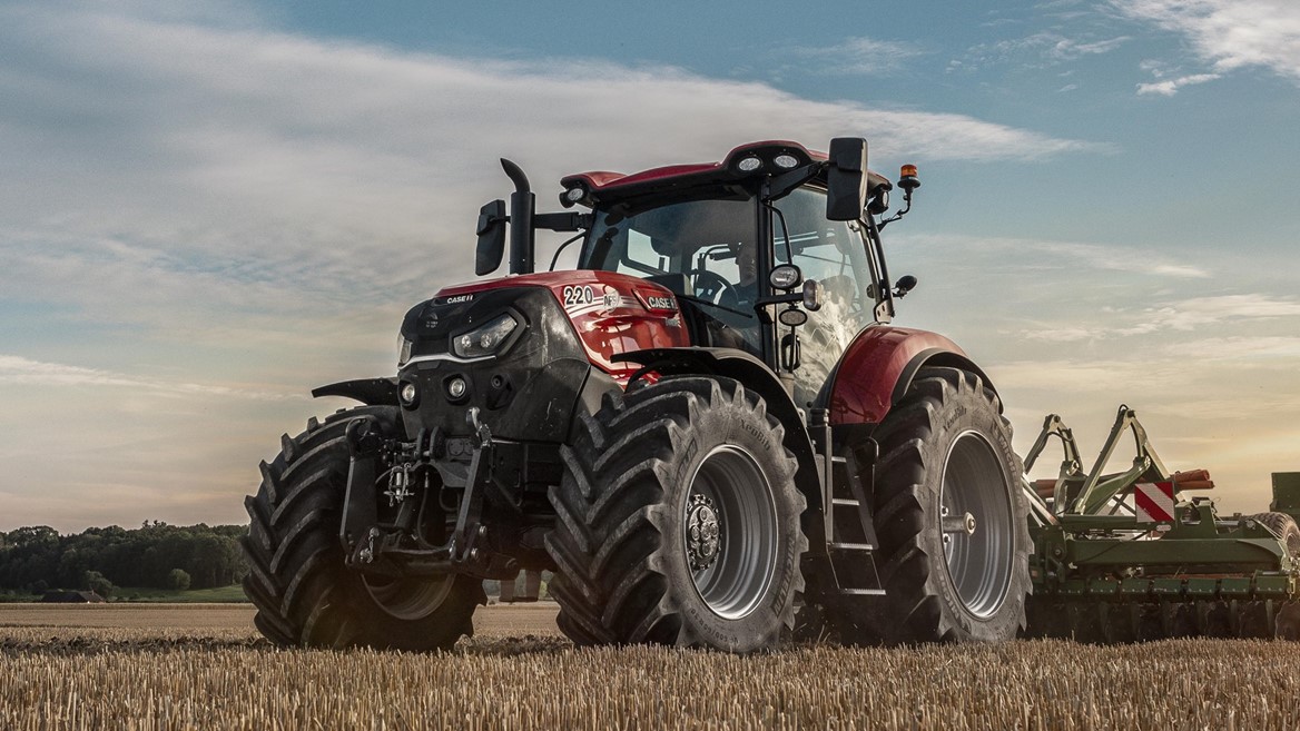 CASE IH red tractor working in large-scale agricultural field