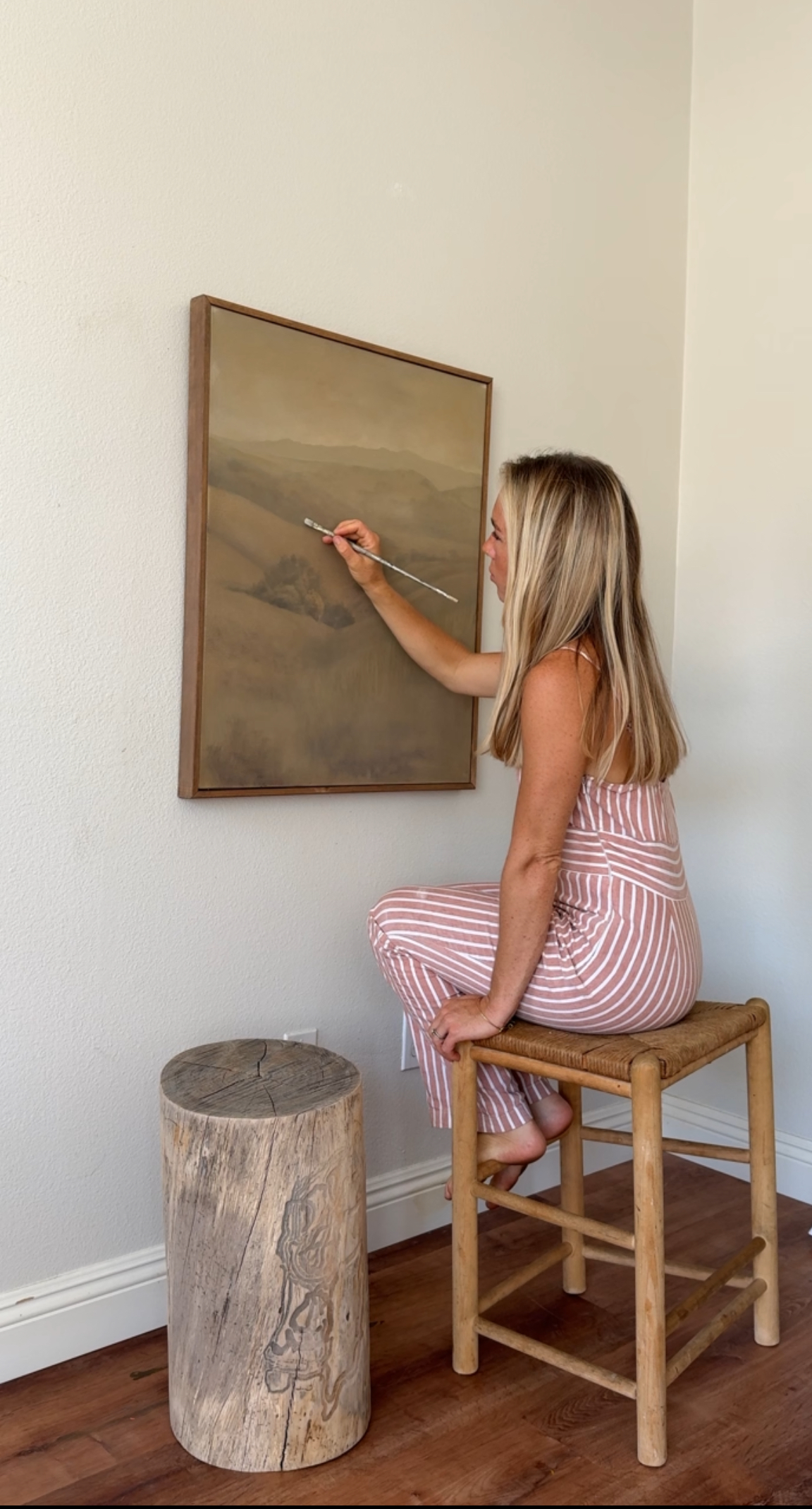 Rachel painting in her studio