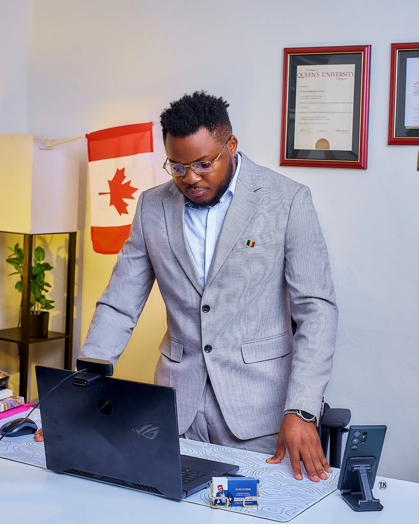 Elias Ayong RCIC working with immigration clients in New Brunswick